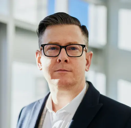 man standing beside wall